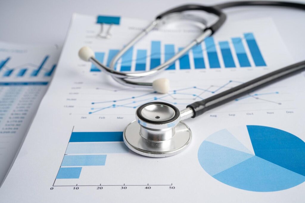 Stethoscope on charts and graphs paper, Finance, Account, Statistics, Investment, Analytic research data economy and Business company concept. Stock Free