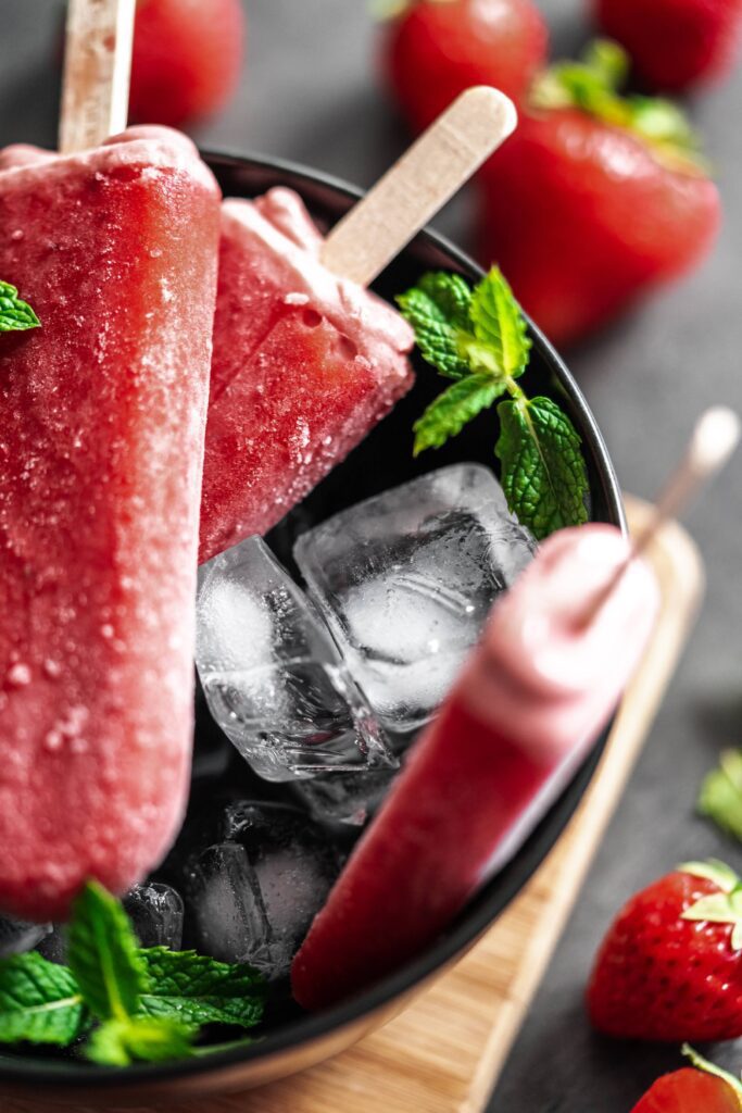 Strawberry Ice Lollies in a Black Bowl Free Photo