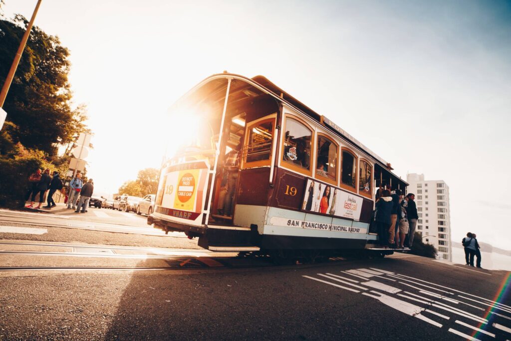 Sun Shining Through The Iconic San Francisco Cable Car Free Photo