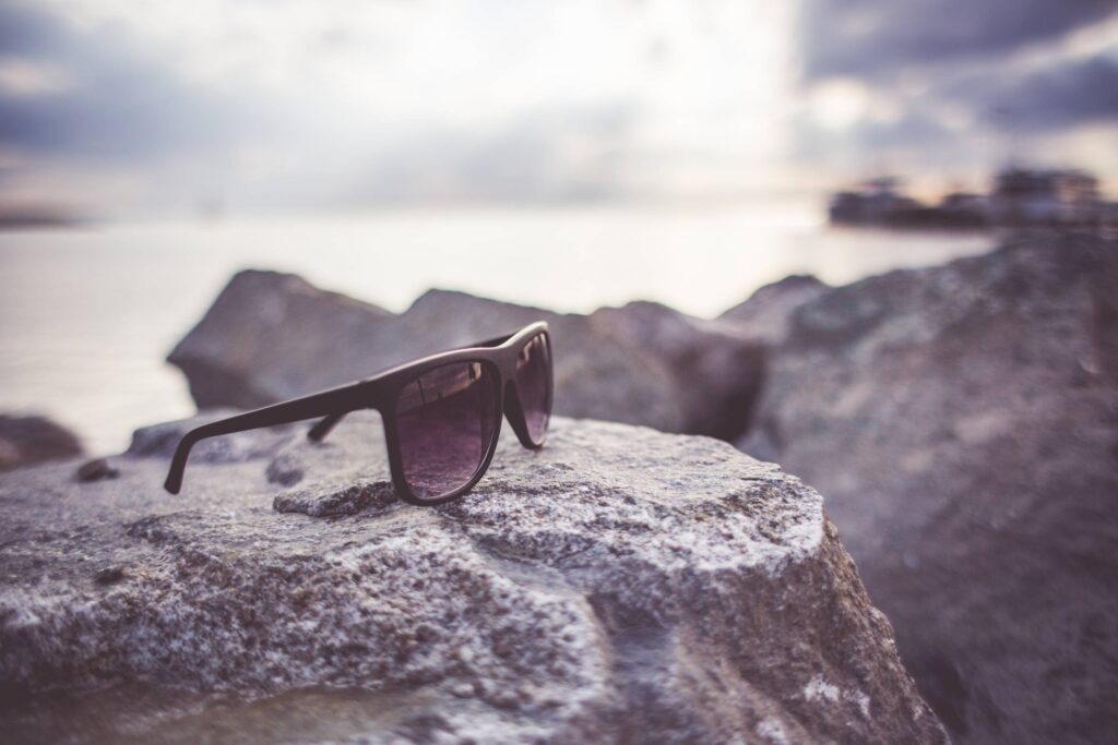 Sunglasses on a Rock Free Photo