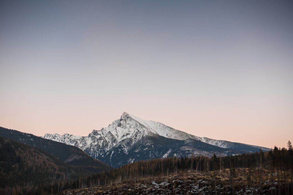 Sunset Over Snowy Top of The Mountain Free Photo