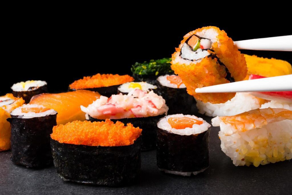 Sushi set on black background, Japanese food. Stock Free