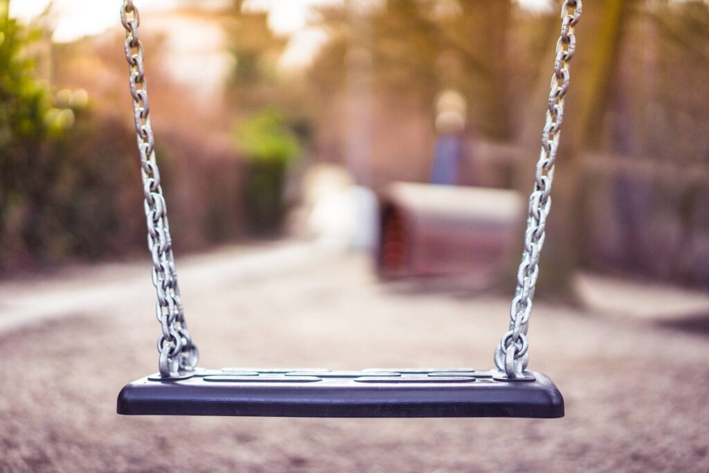 Swing For Kids in City Park Playground Free Photo