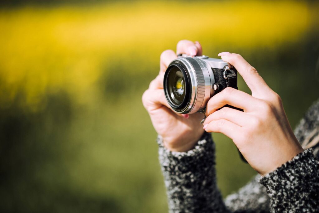 Taking a Photo with Small Mirrorless Camera Free Photo