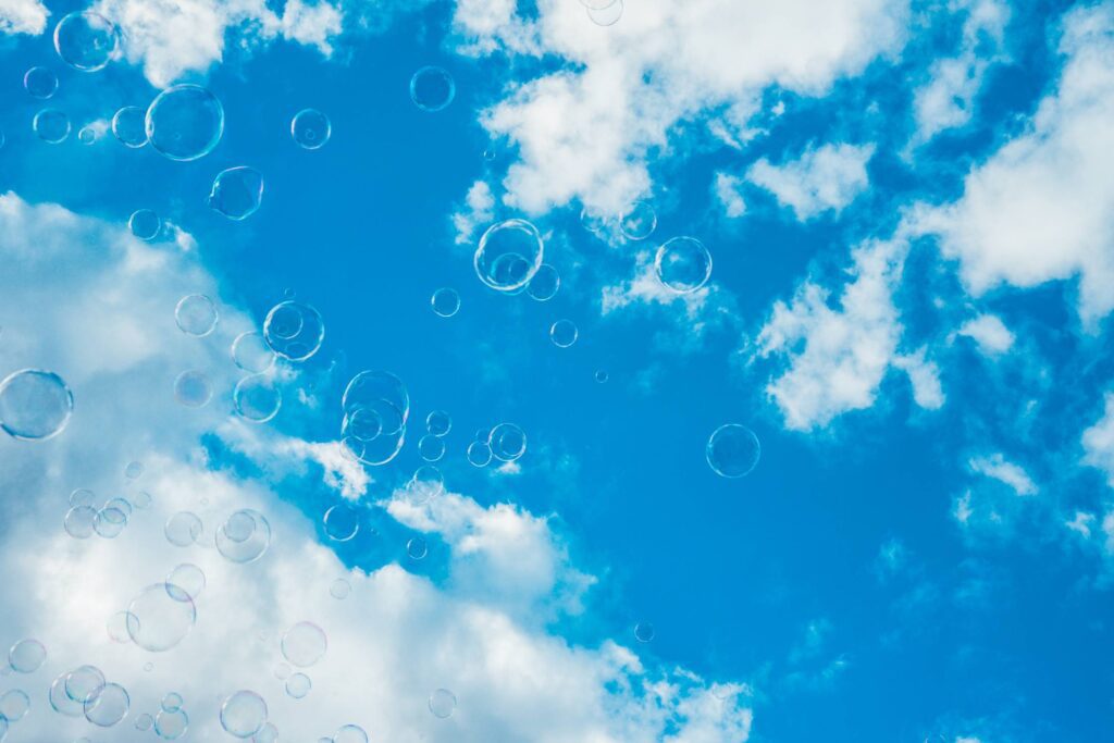 Thousands of Bubbles Against Bright Blue Sky Free Photo