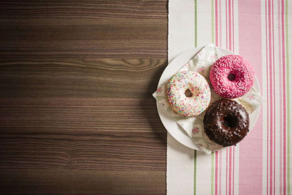 Three Yummy Donuts with Room for Text Free Photo