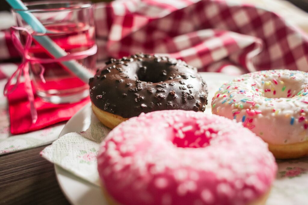 Three Yummy Sweet Colorful Donuts Free Photo