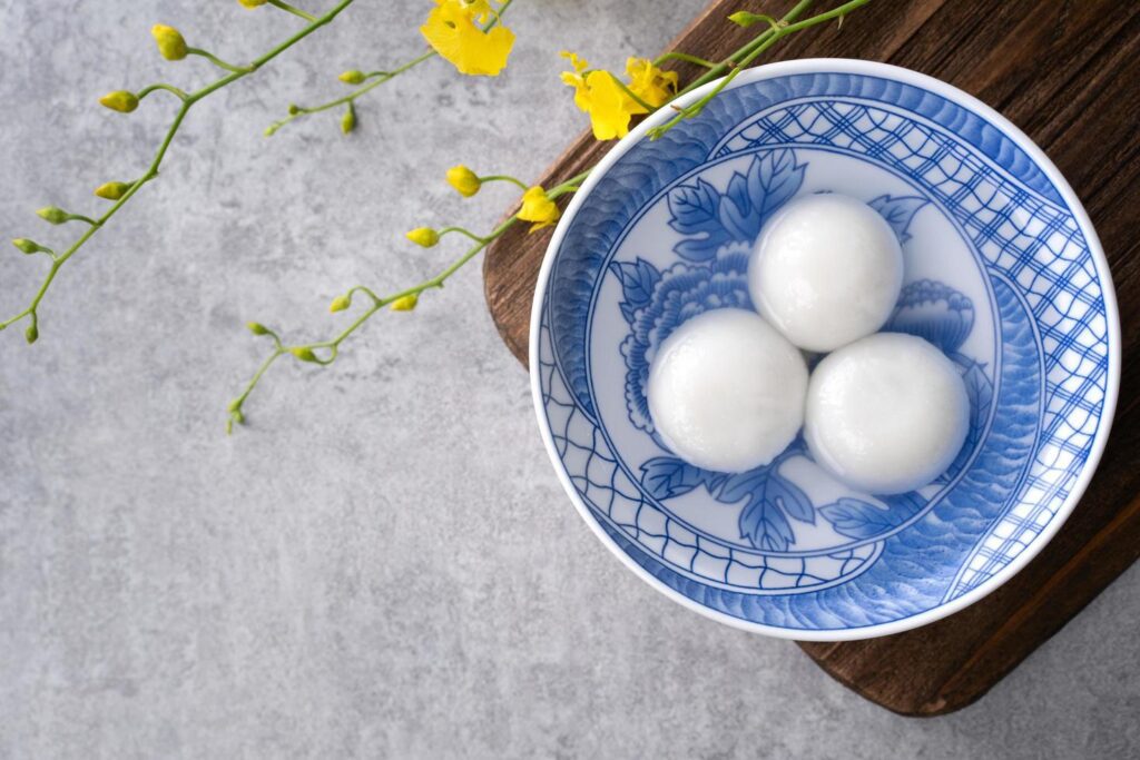 Top view of big tangyuan yuanxiao in a bowl on gray background for lunar new year food. Stock Free