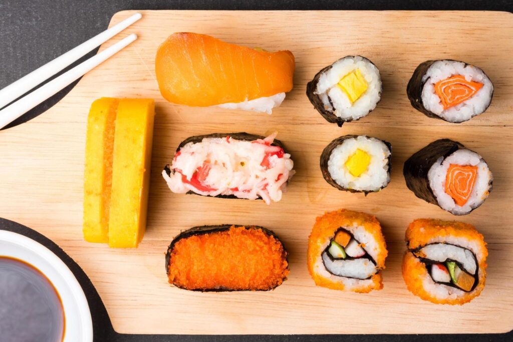 Top view of Sushi set on wooden tray background, Japanese food. Stock Free