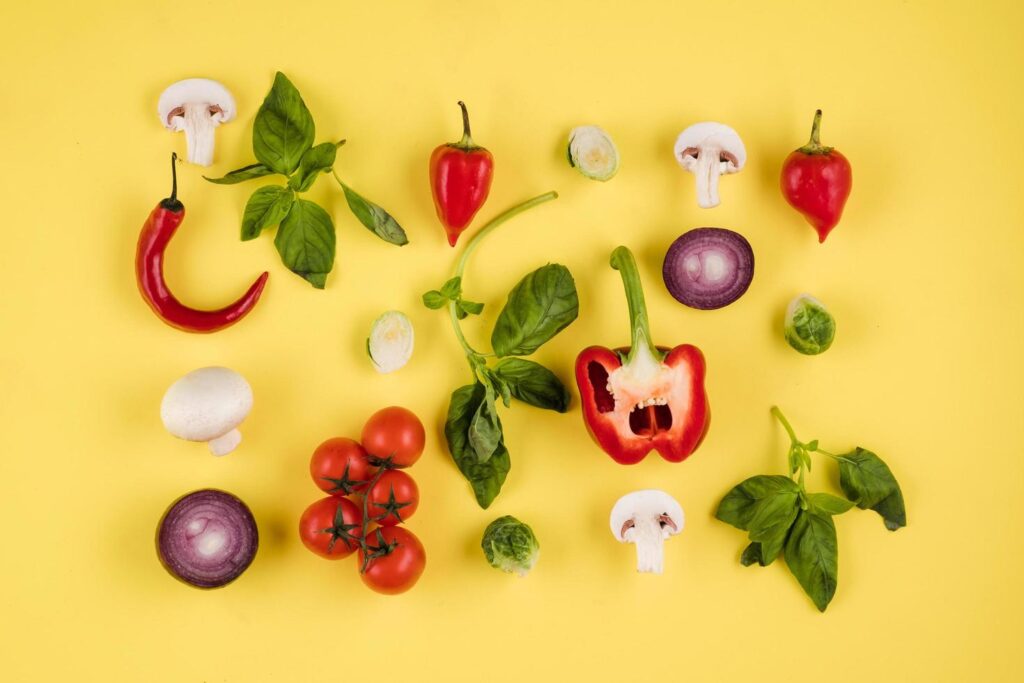 Top view, on a yellow background laid out food. Italian cuisine Stock Free