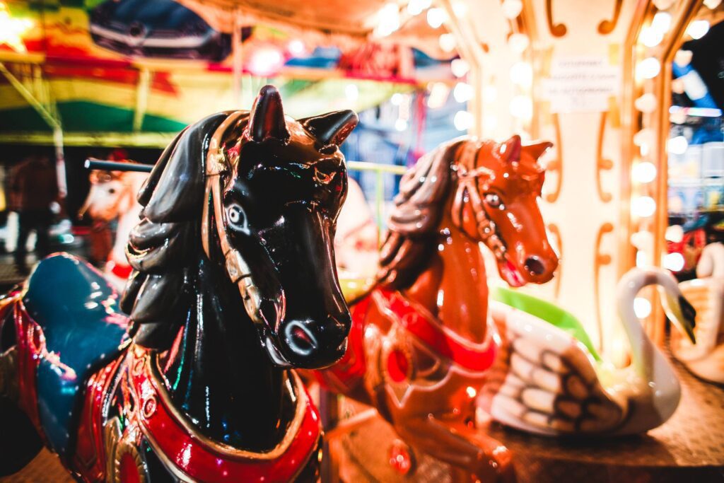 Traditional Carousel Horses on a Fun Fair Ride Free Photo