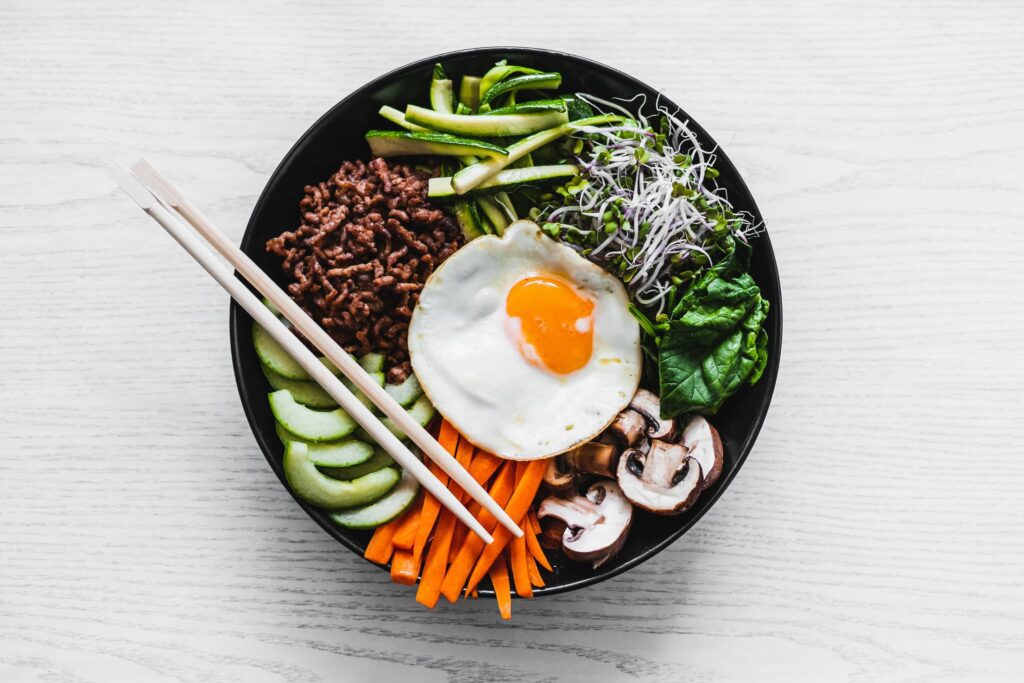 Traditional Korean Bibimbap in a Bowl Free Photo