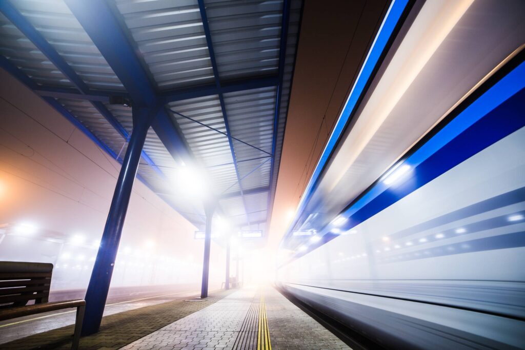 Train Leaving The Railway Station At Night Free Photo