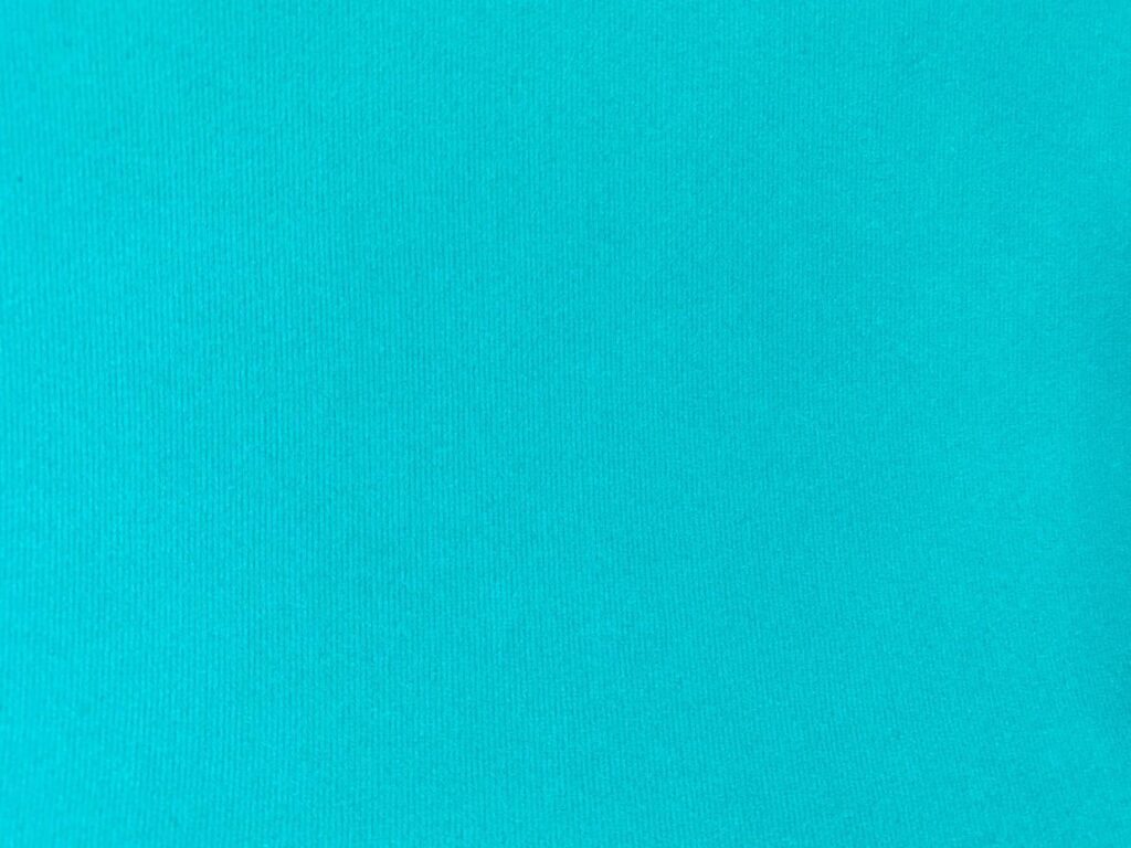 Turquoise velvet fabric texture used as background. Empty turquoise fabric background of soft and smooth textile material. There is space for text. Stock Free