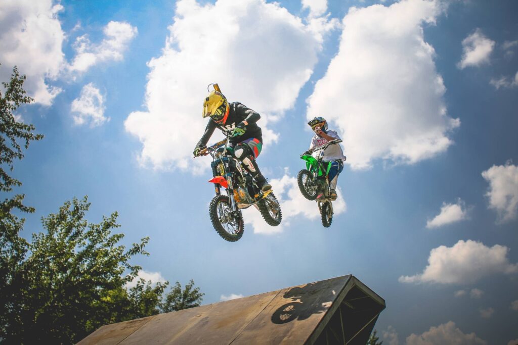 Two Crazy Jumping Pitbikers Free Photo