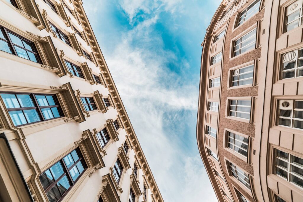 Two Historical Buildings Against Blue Sky Free Photo