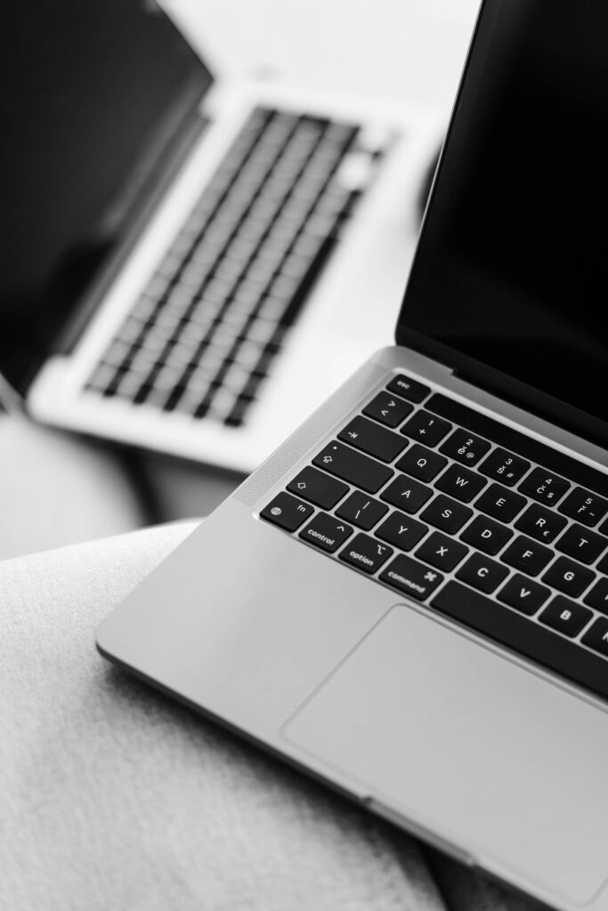 Two MacBook Pro Laptops Black and White Free Photo