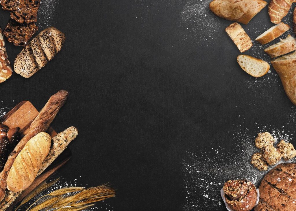 Various breads are placed in a circle on a concrete background Stock Free