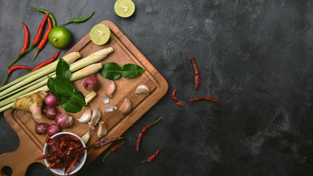 Vegetables healthy food herbs and spices on a cutting board. Raw materials of cooking preparation Tom Yum. Free Photo