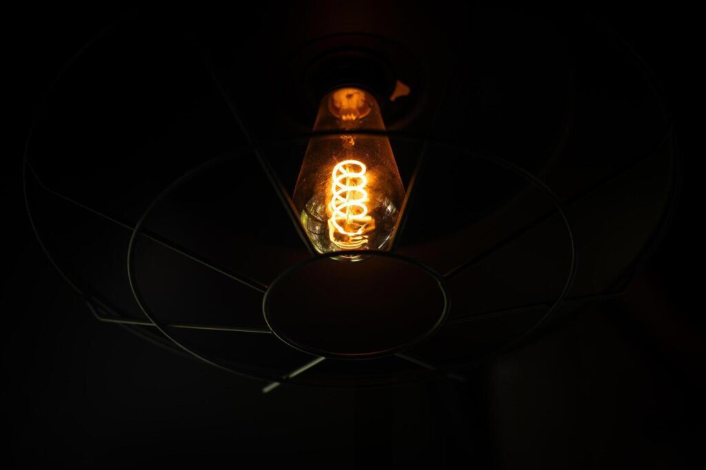 Vintage lamp on black background. Stock Free