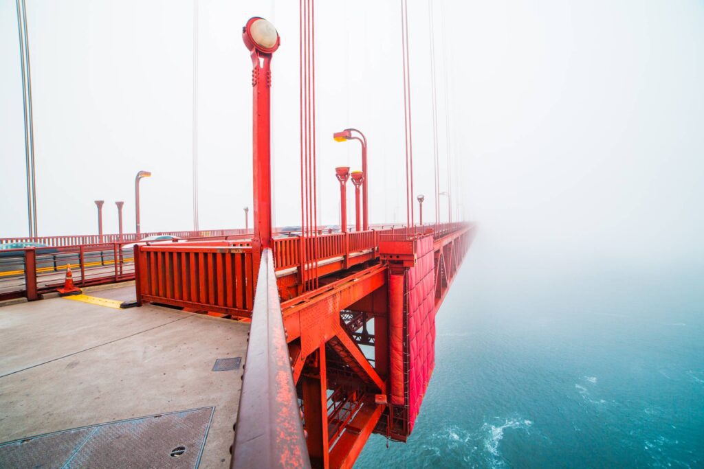 Walking on The San Francisco Golden Gate Bridge Covered in Fog Free Photo