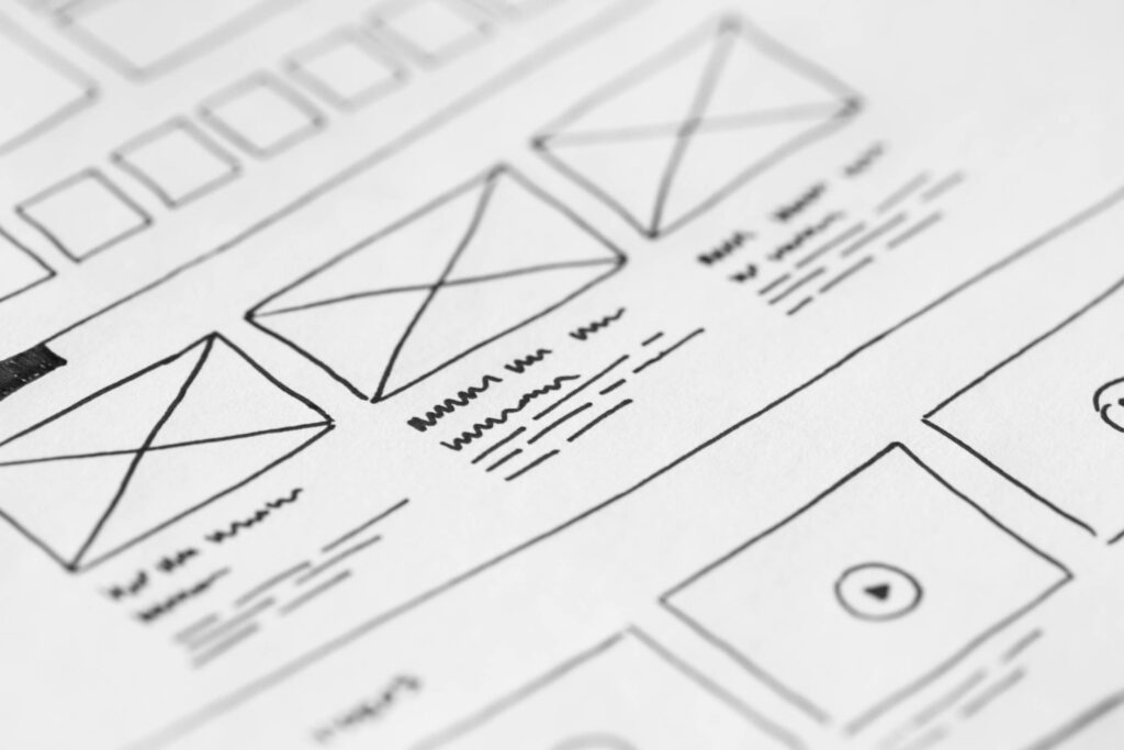 Website Layout Wireframe Ideas Sketched on Paper Free Photo