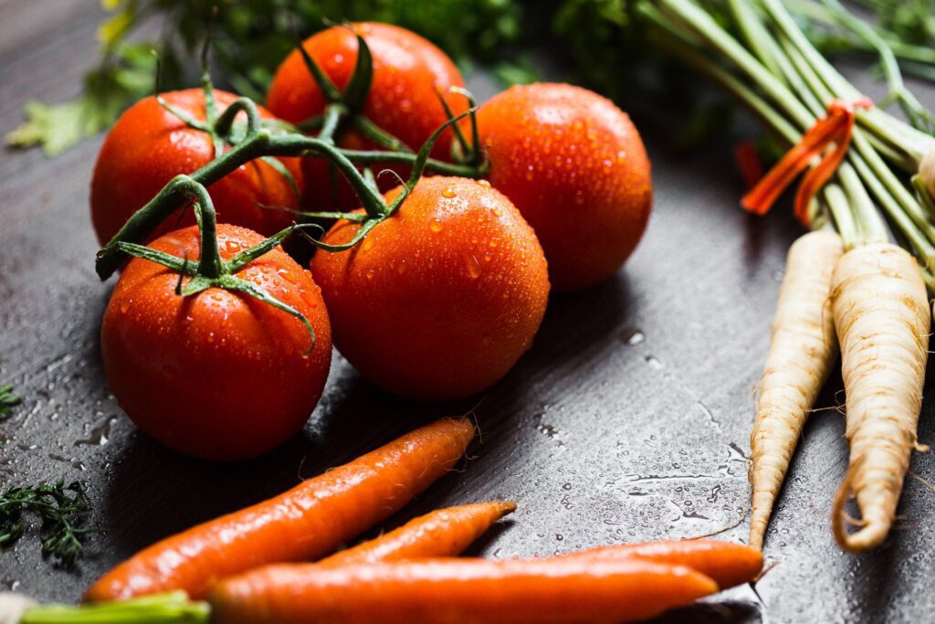 Wet Tomatoes, Carrots and Parsley Ready to Cooking Free Photo