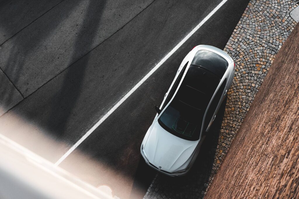 White Modern Car with Black Roof Top View Free Photo