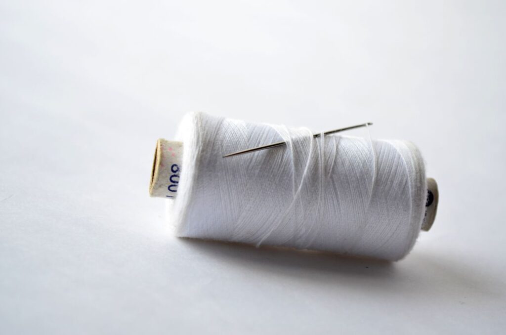 White Thread Needle Stock Free