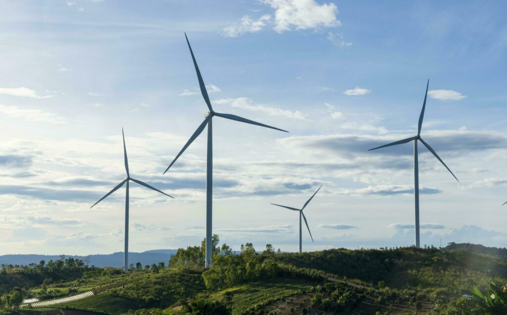 Wind turbines on sunset background. Natural energy Stock Free