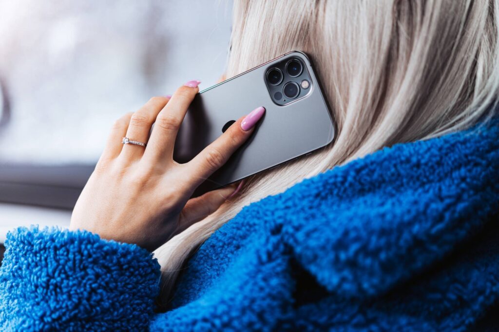 Woman Calling with a New Smartphone Free Photo