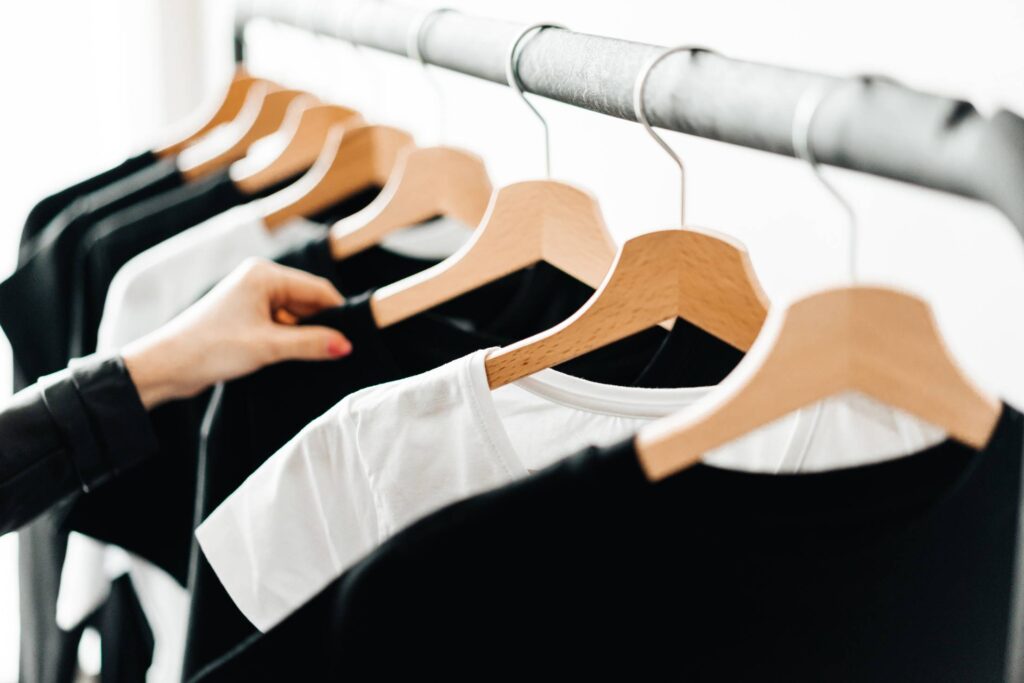 Woman Choosing T-Shirts During Clothing Shopping at Apparel Store #2 Free Photo