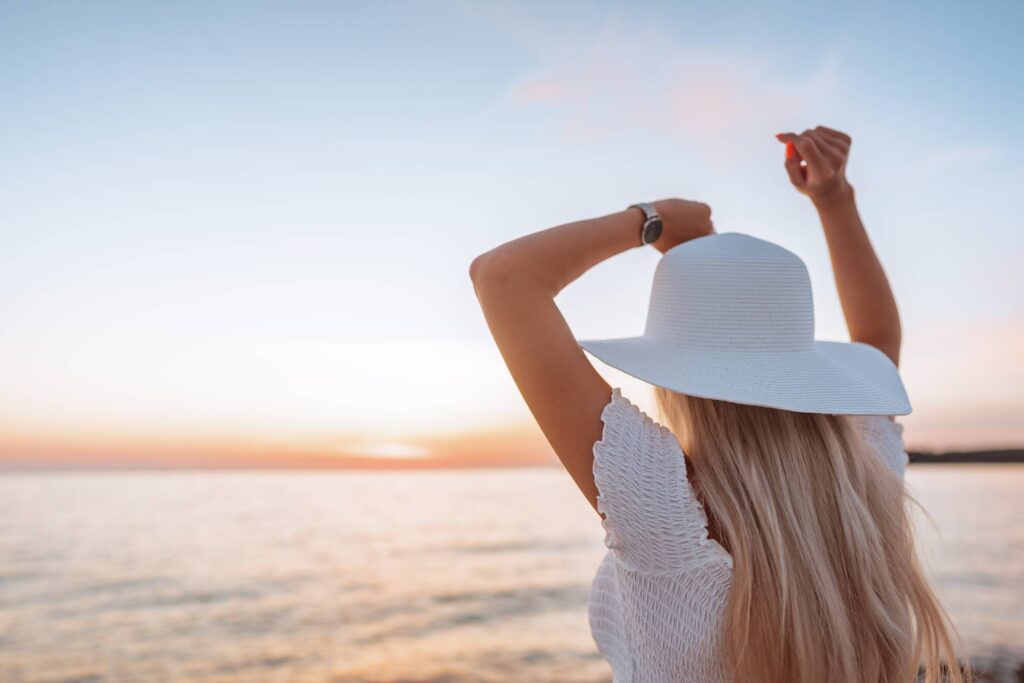 Woman Dancing and Enjoying Beautiful Sunset Free Photo