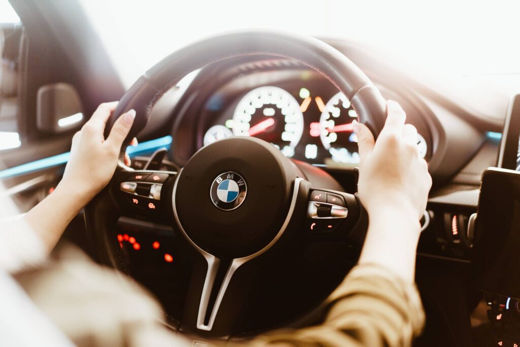 Woman Driving a BMW Luxury Car Free Photo