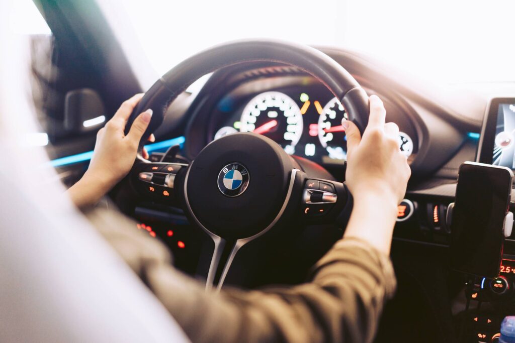 Woman Driving a Luxury Sports Car Free Photo