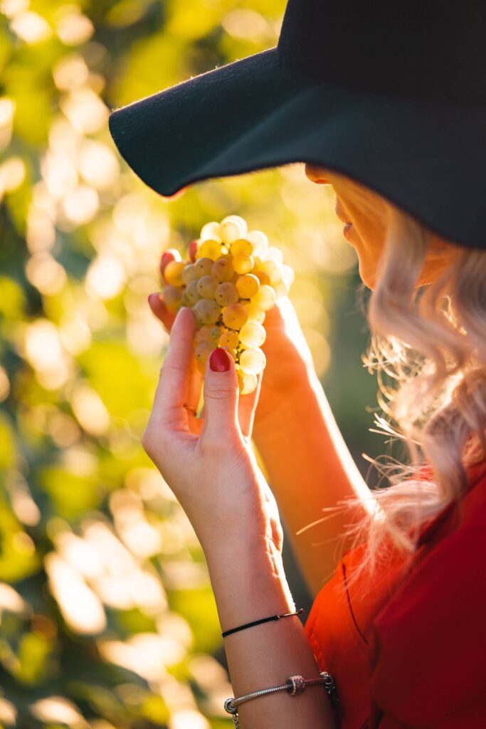 Woman Eating Grapes Free Photo