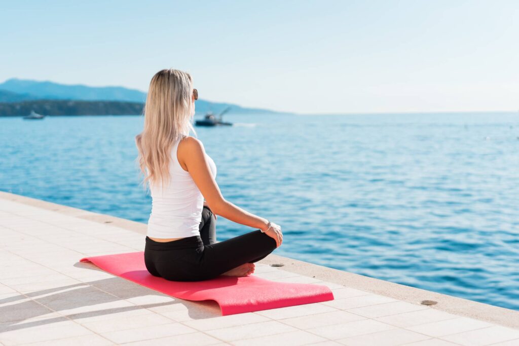 Woman Enjoying Sun During Morning Yoga Free Photo