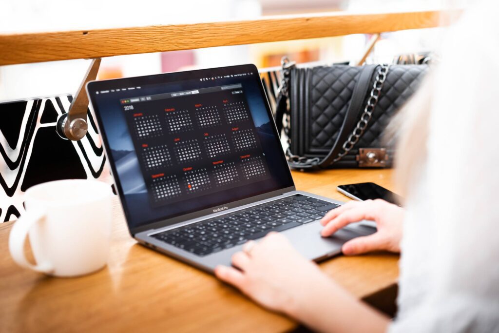 Woman Freelancer Working on Her Laptop Free Photo