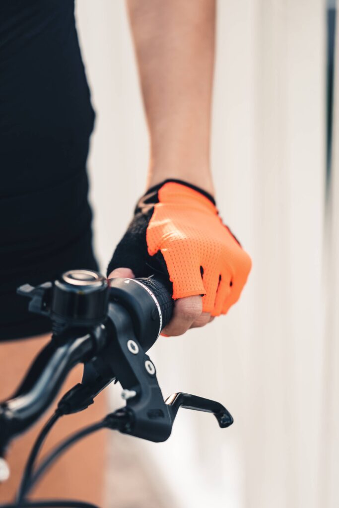 Woman Holding a Bicycle Handlebar Free Photo