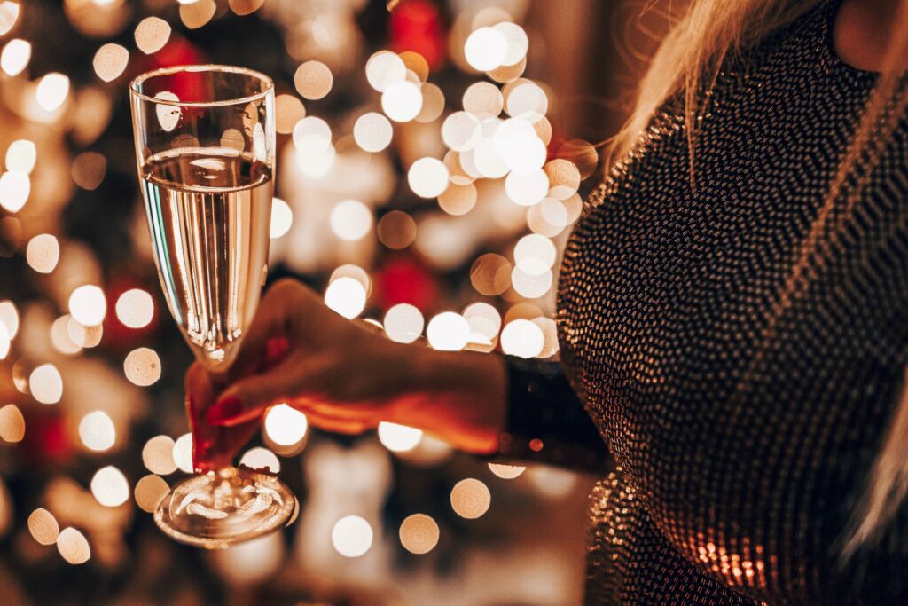 Woman Holding a Champagne Glass with Prosecco Free Photo