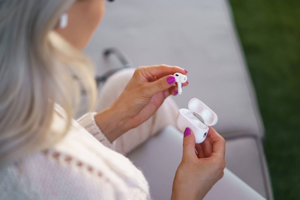 Woman Holding AirPods Pro Free Photo