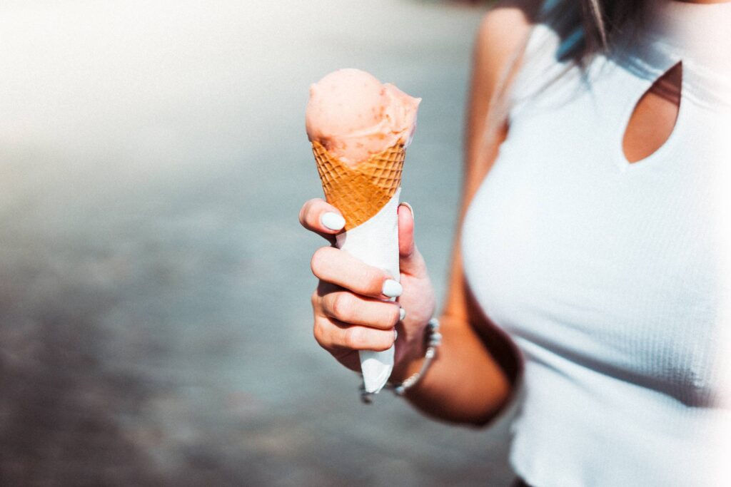 Woman Holding an Ice Cream Free Photo