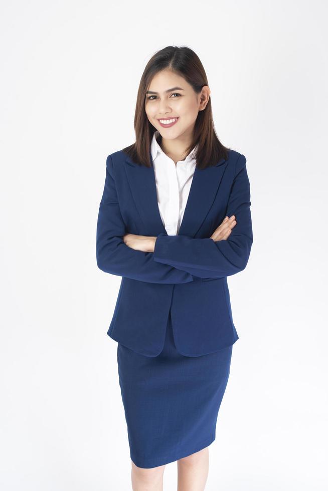 Woman in blue suit is smiling on white background Stock Free