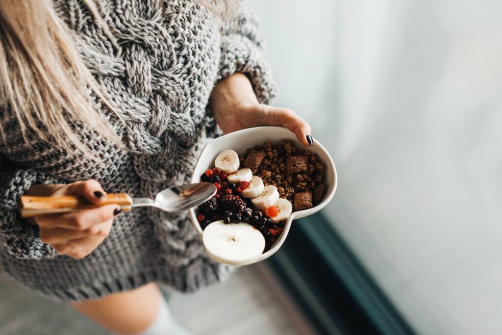 Woman in Knitted Sweater Enjoying Morning Breakfast Free Photo