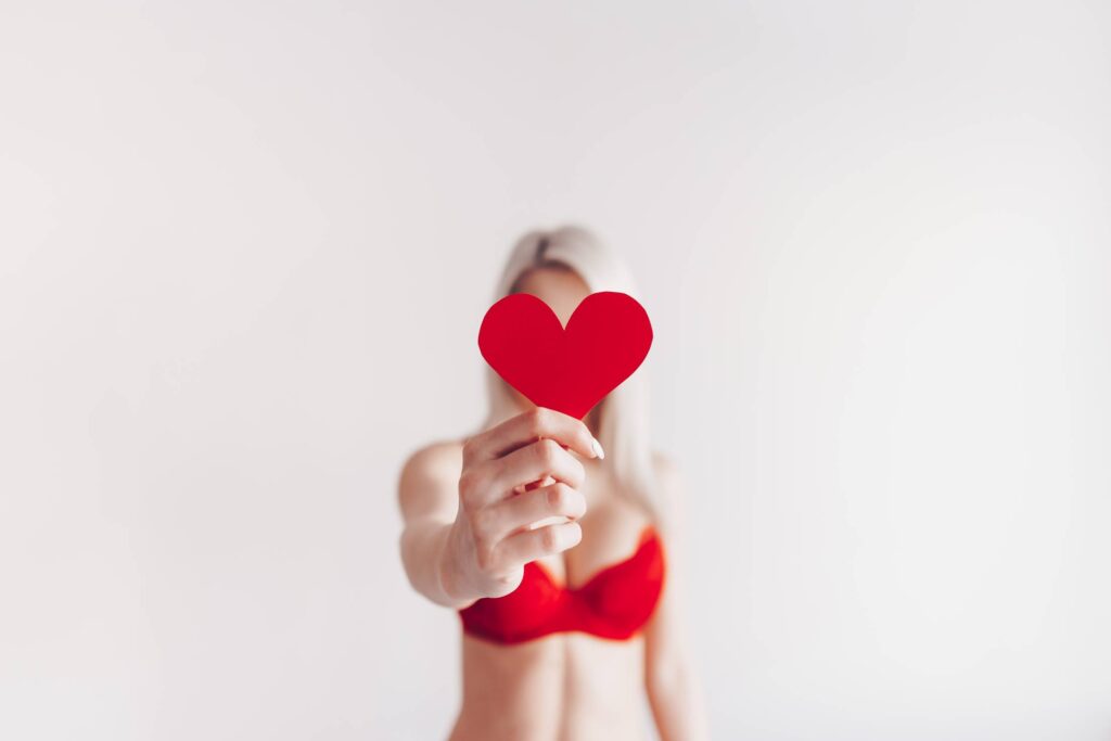 Woman in Lingerie Showing Red Paper Heart Free Photo