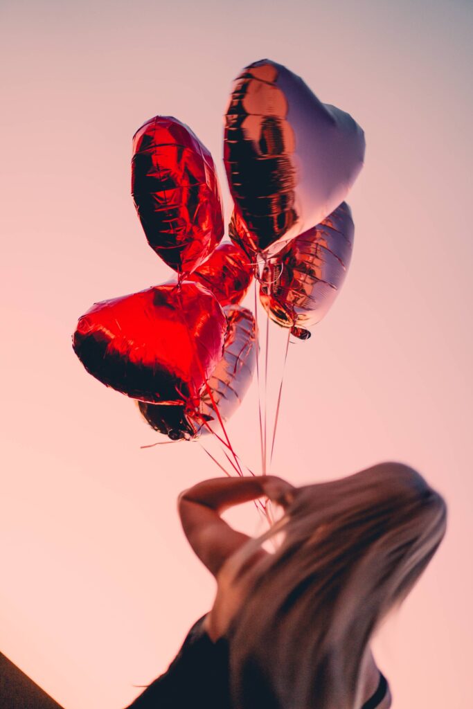 Woman in Love Holding Heart Shaped Balloons Outdoors Free Photo