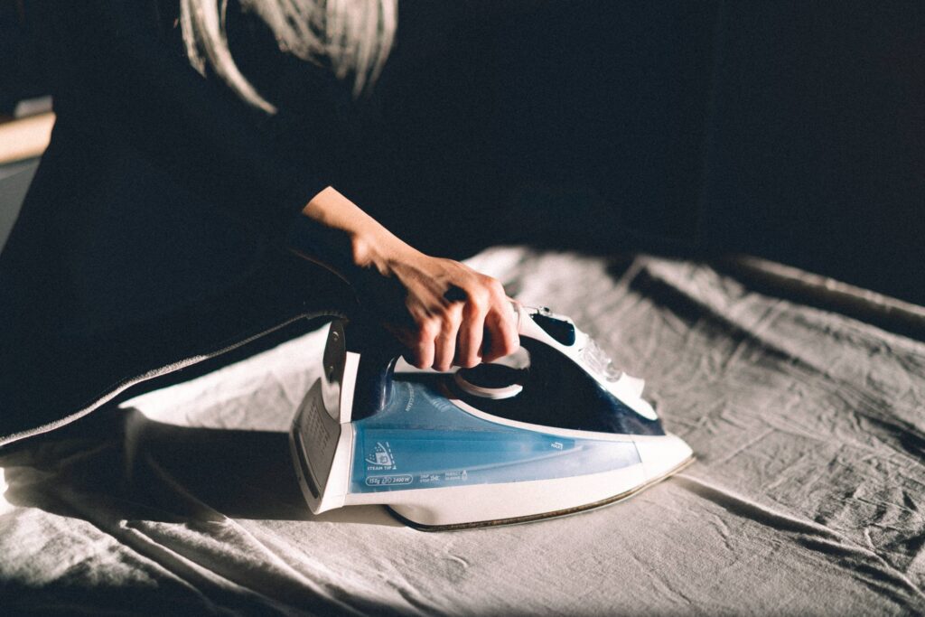 Woman Ironing Clothes Free Photo