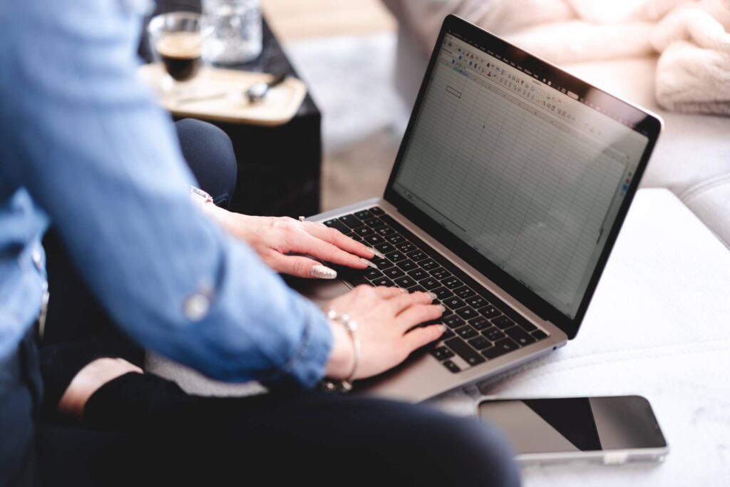 Woman is Typing on Her Laptop on The Sofa Free Photo