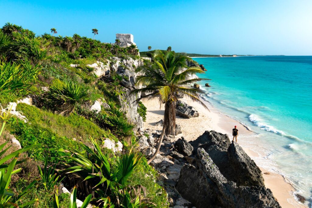 Woman on a Beach near Ruins in Tulum Mexico Free Photo