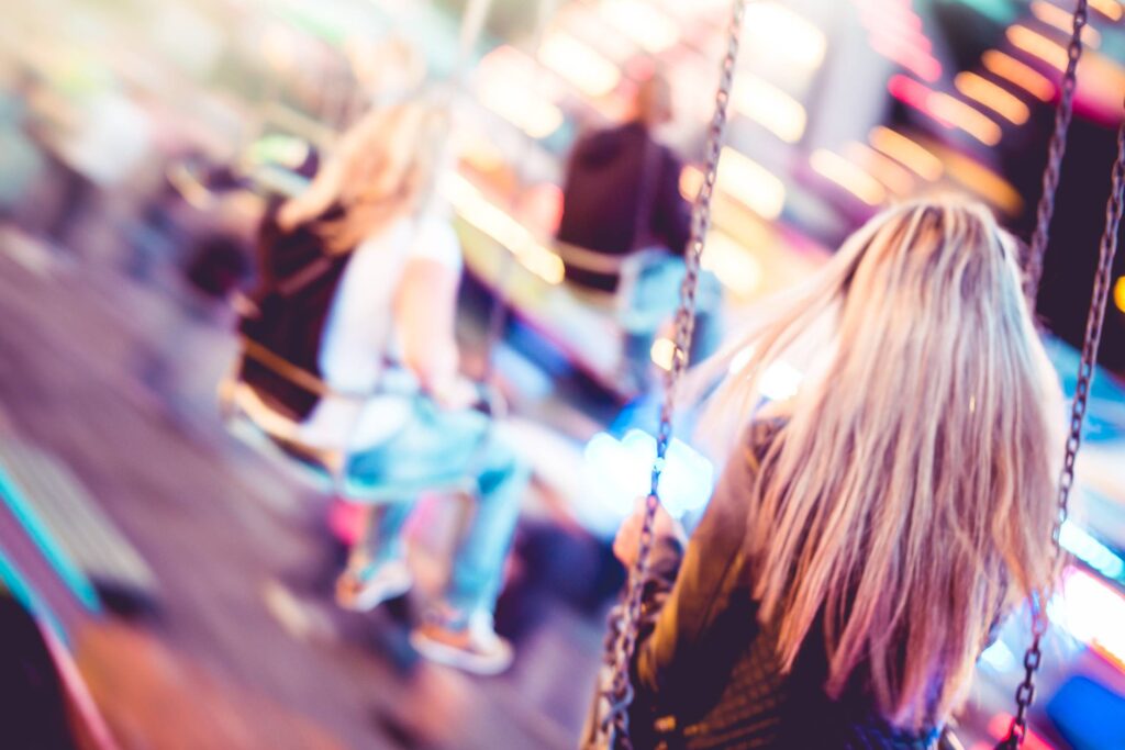 Woman on Carousel Swing Ride Free Photo